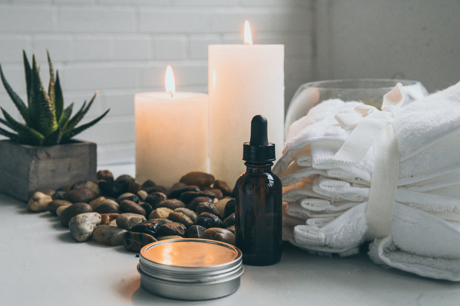A pleasant dispay of candles, linens, and massage oils